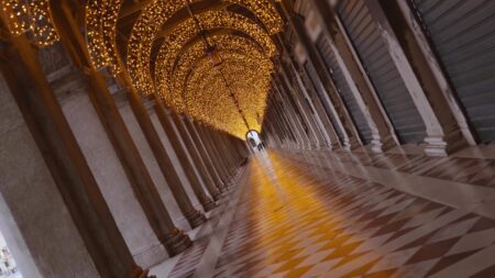 Under the arcades of Venice with Christmas lights