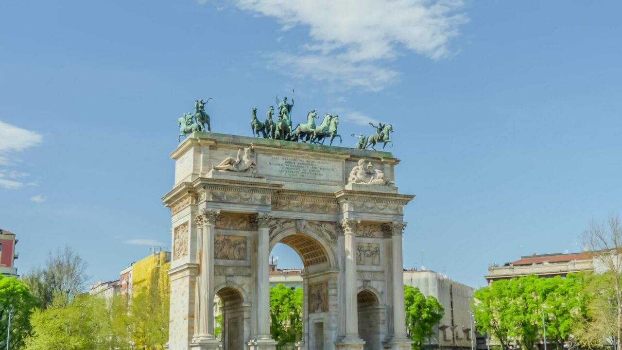 Arch of Peace with statues on top built in park of Milan