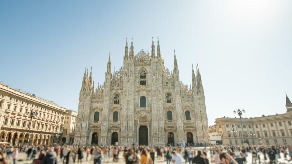 Crowded square against Duomo built in center of Milan