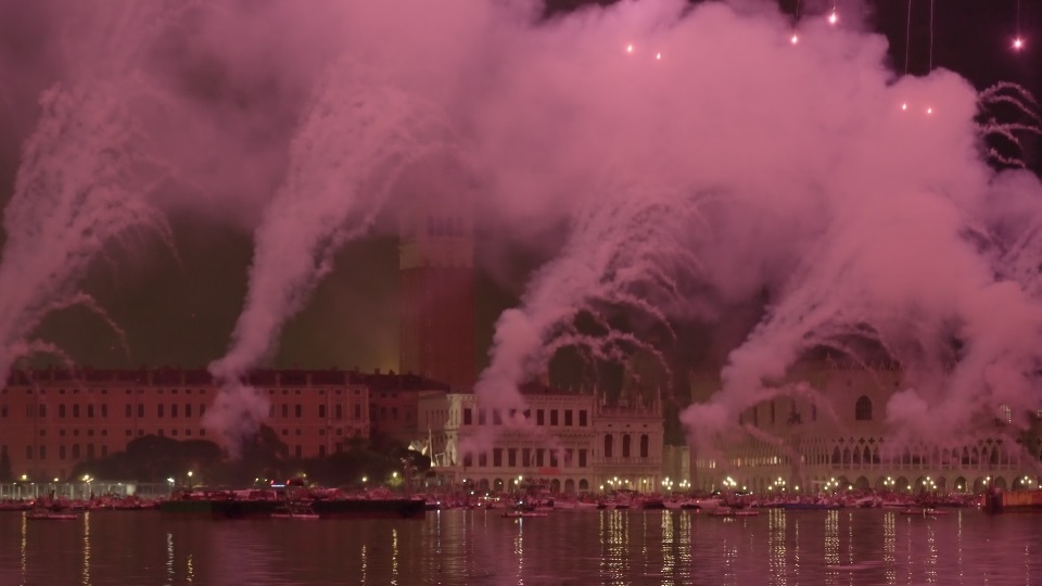Colorful fireworks burst in air spreading dense smoke