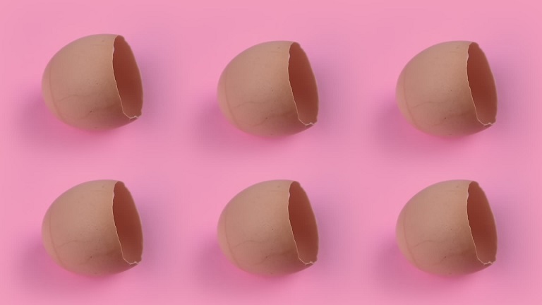 Egg shells on pink background