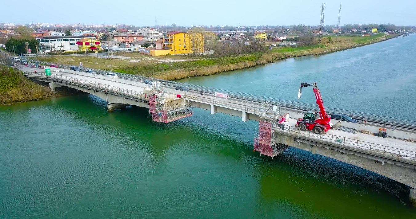 A bridge over the river with a part under construction