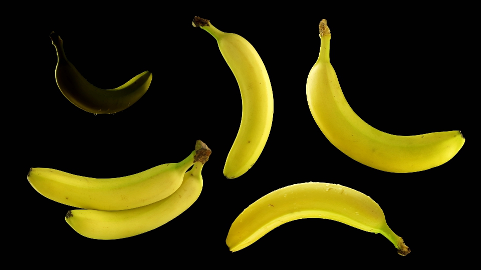 Bananas rotate on isolated black background
