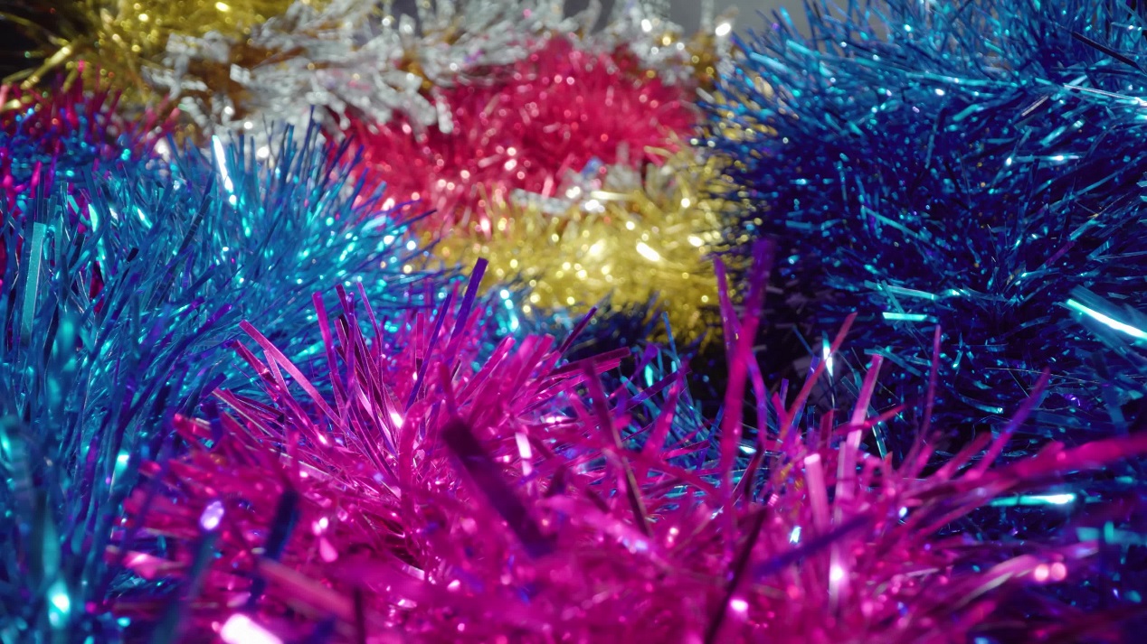 Motion over Christmas tree tinsel ornaments in studio