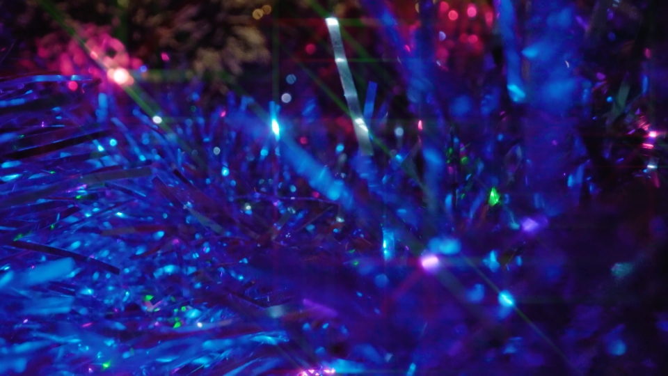 Mystery sparkling tinsel garlands and glowing fairy lights