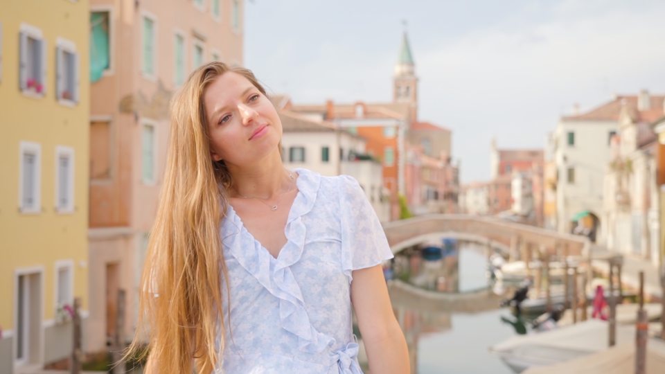 Beautiful young woman relaxes in the sun in Chioggia