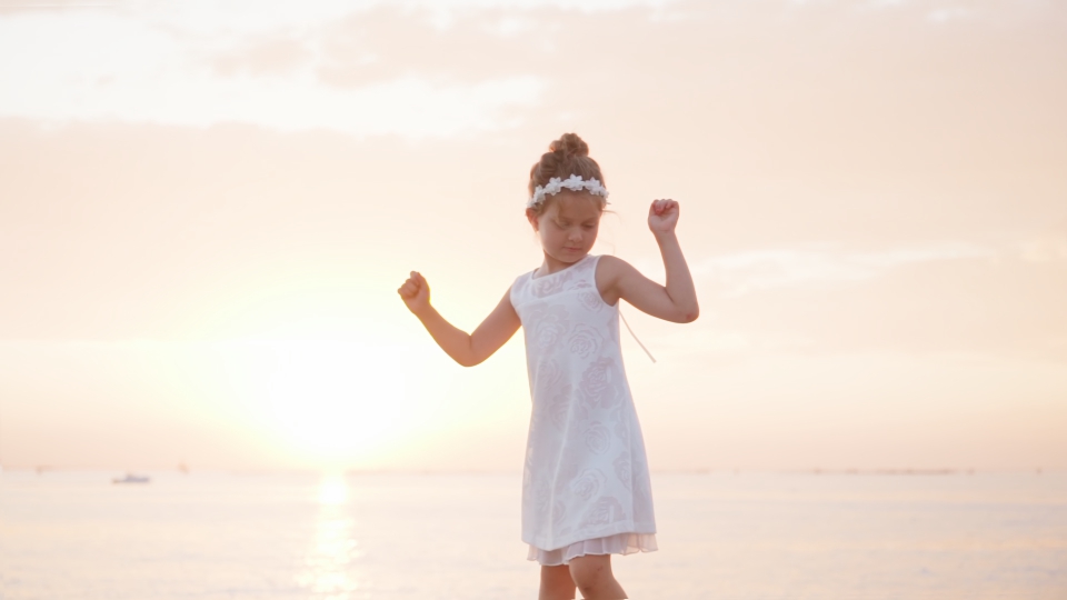 Little girl dances and has fun at sunset RoyaltyFree Video